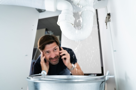 man calling about leak under sink